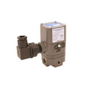 Industrial gas solenoid valve with multiple connection ports and label, isolated on a white background.